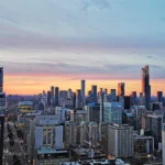 A vibrant aerial view of best Toronto neighborhoods showcasing modern architecture, green spaces, and bustling city life, highlighting the diverse charm and investment potential of the area.